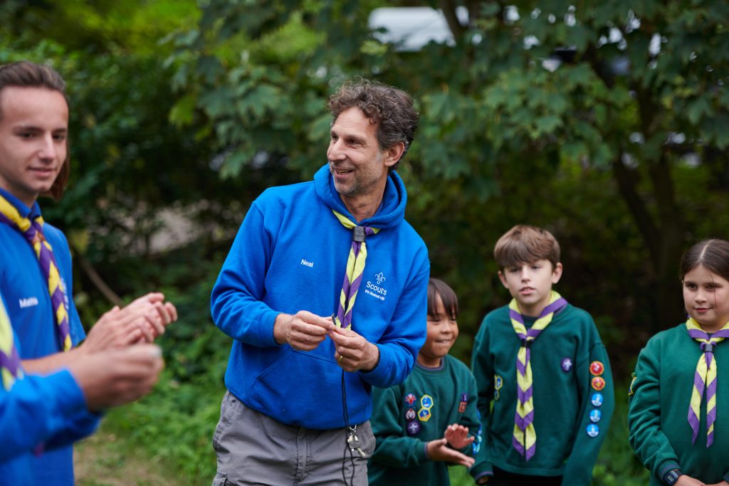 A volunteer leader running an activity with Cubs